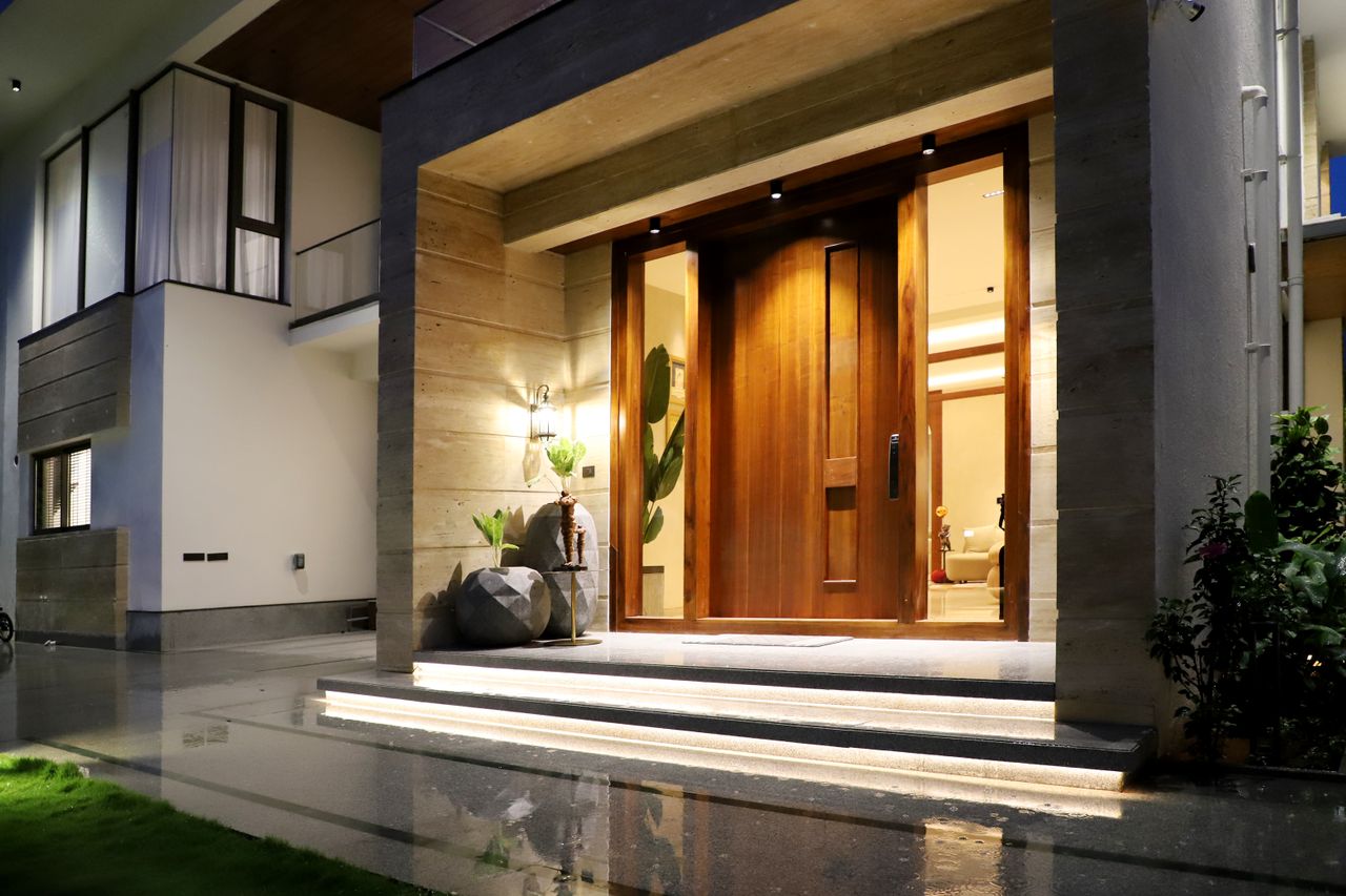 Stone pathway leading to a modern Pakistani villa